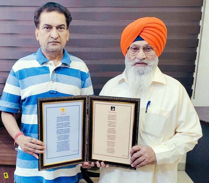 BJP leader, Balbir Ram Rattan presenting his poetry on Guru Ravi Dass Ji to former MLC, Charanjit Singh Khalsa during a function at Jammu on Sunday. BJP leader, Balbir Ram Rattan presenting his poetry on Guru Ravi Dass Ji to former MLC, Charanjit Singh Khalsa during a function at Jammu on Sunday.