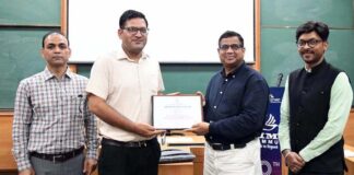 A participant being presented with a certificate during a capacity building programme on MSME Health Clinics at IIM Jammu on Thursday.