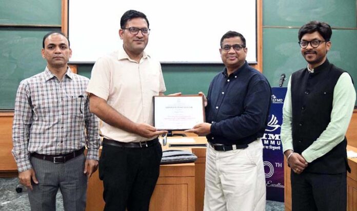 A participant being presented with a certificate during a capacity building programme on MSME Health Clinics at IIM Jammu on Thursday.