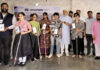 MLA Sham Lal Sharma presenting smart canes to visually impaired persons in Jammu.