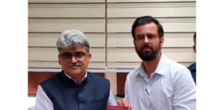 Satyarth Pandita, the author of book ‘Grammar of the Void’ presenting his book to Chief Secretary, Atal Dulloo at Civil Secretariat Jammu on Thursday.