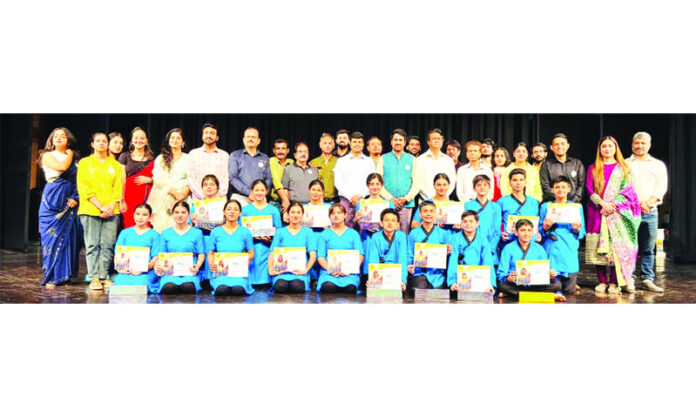 Natrang artists along with others posing for a group photograph after they were felicitated by Natrang on its 44th Foundation Day.
