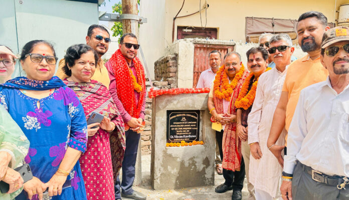 MLA Bahu, Ch. Vikram Randhawa inaugurating the newly constructed lane and drain in Ward No. 52 on Thursday.