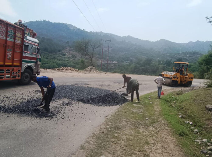 Resurfacing work of Dhar road going on in full swing.