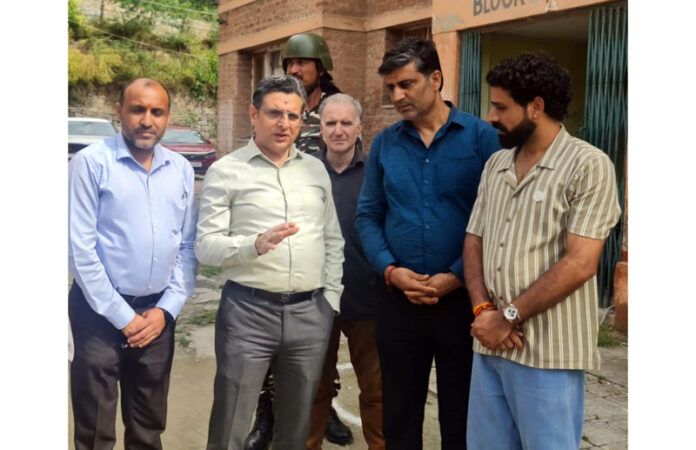 Relief & Rehabilitation Commissioner, Dr Arvind Karwani listening the issues of PM package employees at Mattan on Friday.