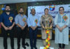Dignitaries posing during lamp lighting and oath ceremony.