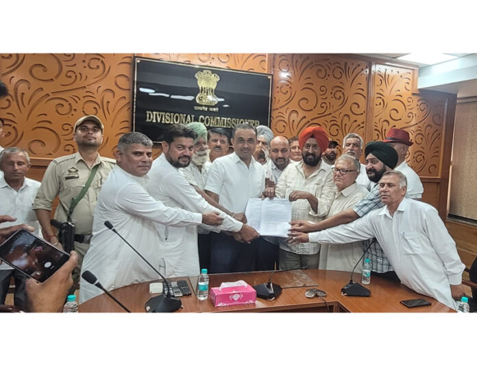Border villagers led by Cong leader TS Tony submitting memorandum to Div Com Jammu on Monday. Border villagers led by Cong leader TS Tony submitting memorandum to Div Com Jammu on Monday.