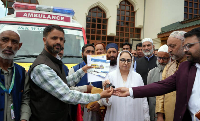 J&K Waqf Board Chairperson, Dr Darakhshan Andrabi handing over keys of ambulance to a prominent person at Charar-i-Sharief.