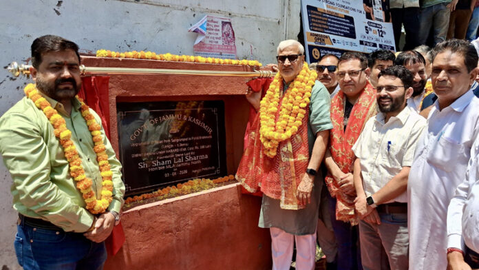 Sham Lal Sharma unveiling foundation stone of road upgradation project.