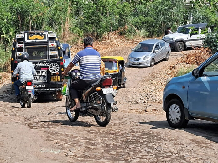 Vehicles passing through a seasonal nallah as Thathar bridge remains closed for traffic. Vehicles passing through a seasonal nallah as Thathar bridge remains closed for traffic.