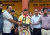 School management presenting a memento to boxer Yasser during a programme at GBMHSS Rajouri. -Excelsior/Imran