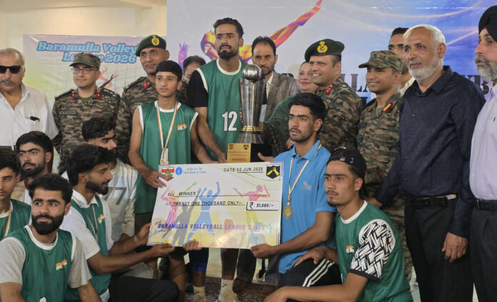 Winners posing along with trophy during closing ceremony.