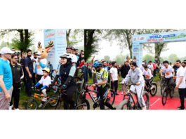 Chief Minister Omar Abdullah interacting with cyclists during the programme.