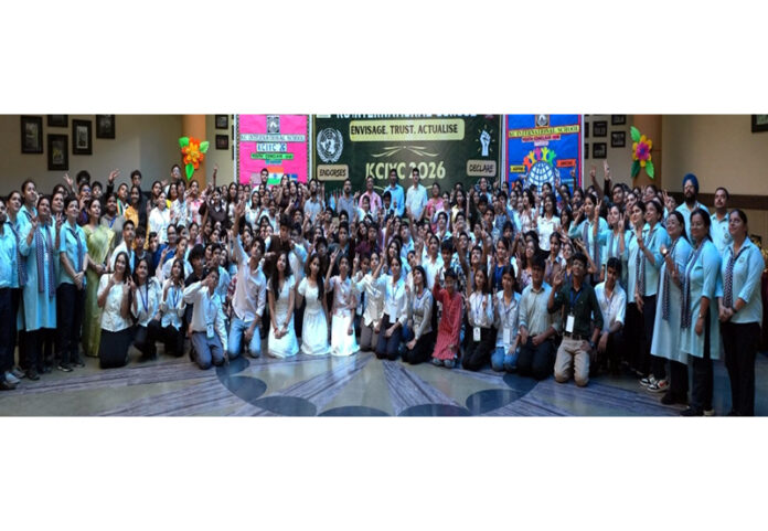 Participants posing with dignitaries during the Youth Conclave.