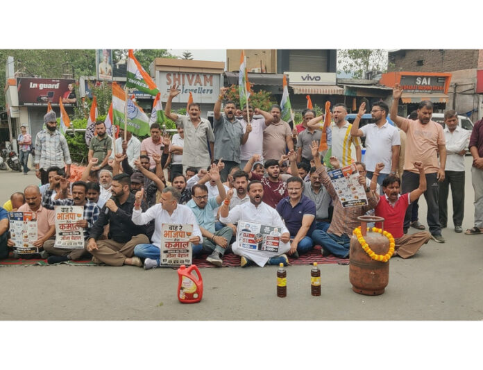 Cong activists staging protest at Udhampur on Monday.