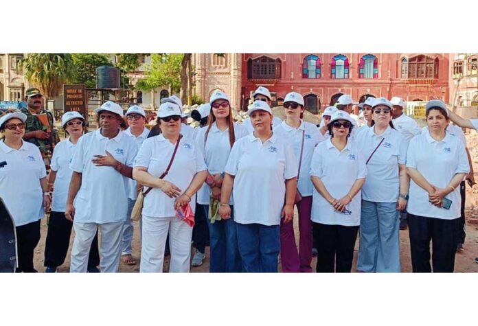 Participants posing for a photograph with dignitaries during Walkathon organized by Akashvani Jammu.
