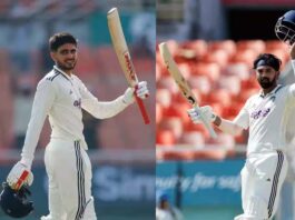 Shubman Gill (L) and KL Rahul (R) raising their bats after scoring centuries against Afghanistan in 1st Test match at Mullanpur.