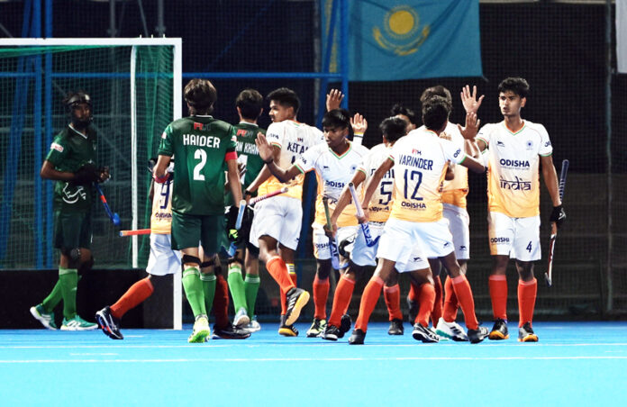 Indian players celebrating after defeating Pakistan in hockey match on Friday.