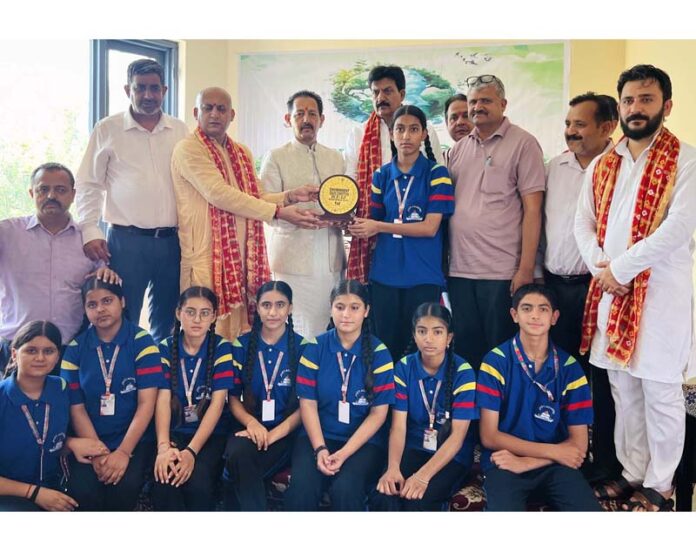 BJP general secretary, Baldev Singh Billawaria giving away prizes to students at a seminar in Jammu on Tuesday.