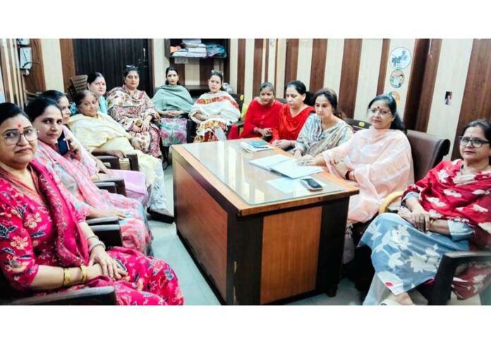 BJP general secretary, Sanjita Dogra hearing women's grievances at Jammu on Tuesday. BJP general secretary, Sanjita Dogra hearing women's grievances at Jammu on Tuesday.