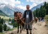A service provider with his horse at Amarnath Yatra route as Police launches an App to enhance security of the visiting pilgrims.