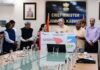 CM handing over cheque to a beneficiary of Mission YUVA at Srinagar on Thursday.