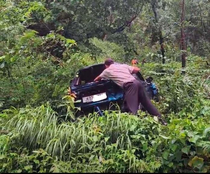 Ill fated car rests in a deep gorge near Gandoh after falling from a road on Tuesday. -Excelsior/Tilak Raj Ill fated car rests in a deep gorge near Gandoh after falling from a road on Tuesday. -Excelsior/Tilak Raj