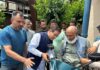 MLA Zadibal, Tanvir Sadiq handing over 3-wheel scooter to a specially-abled person at Makhdoom Sahib.