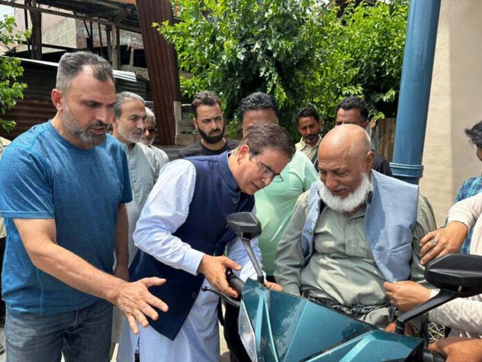 MLA Zadibal, Tanvir Sadiq handing over 3-wheel scooter to a specially-abled person at Makhdoom Sahib. MLA Zadibal, Tanvir Sadiq handing over 3-wheel scooter to a specially-abled person at Makhdoom Sahib.