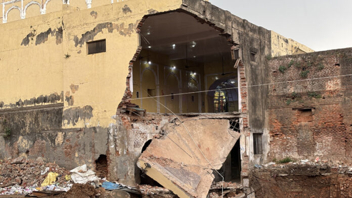 The collapsed wall of the historic Gadadhar temple in Jammu. -Excelsior/Rakesh