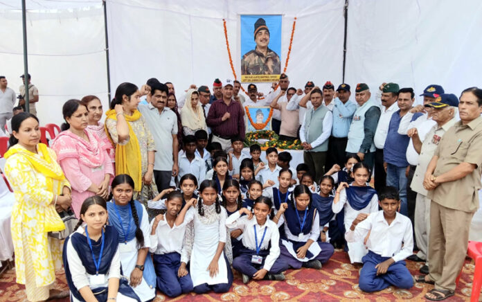 Prominent people, retired army personnel, MLA Kathua and school children during a function to pay tribute to Shaheed Satpaul Singh on Wednesday. -Excelsior/Nishant