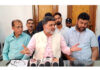 EJAC president Wajahat Hussain Malik along with general secretary, Sajad Ahmad Parray during a press conference in Srinagar on Monday. - Excelsior/Shakeel