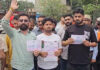 People protesting in Kathua against inflated electricity bills on Monday. -Excelsior/Nishant
