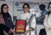 A dignitary from GDC Baramulla presenting a souvenir to Deputy Advocate General Meenakshi Slathia during a programme on Thursday.