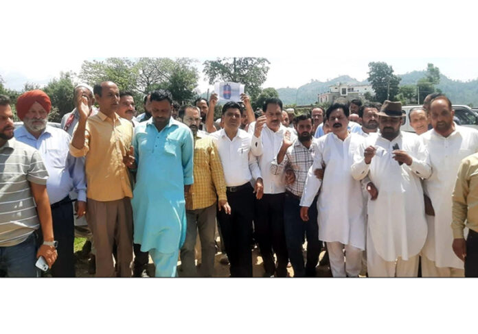Cong activists staging protest in Rajouri. -Excelsior/Imran